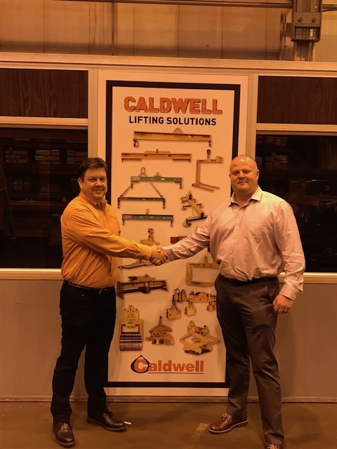 Doug Stitt (left), president and CEO at Caldwell, welcomes Malcolm Peacock, business development specialist.